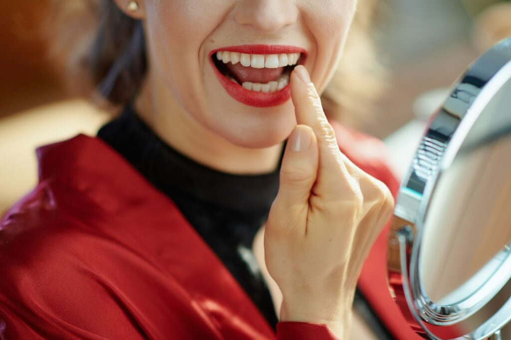 woman showing teeth after cosmetic dental bonding