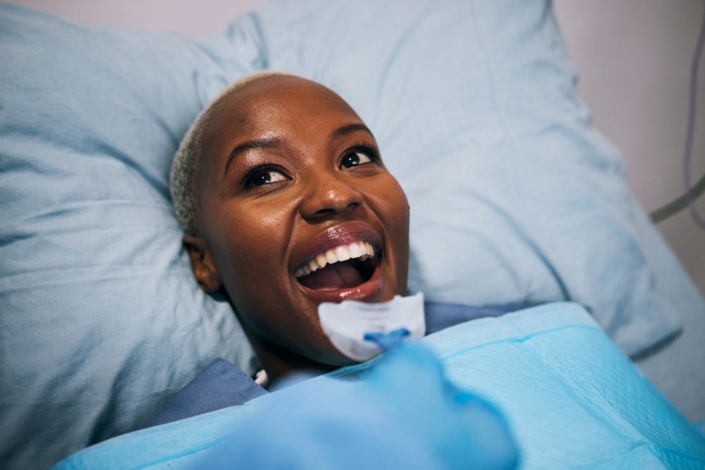 smiling dental patient after her dental service