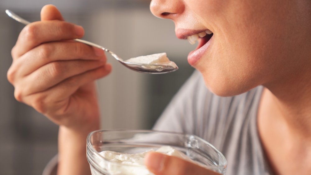 Yogurt eating concept, natural healthy probiotic